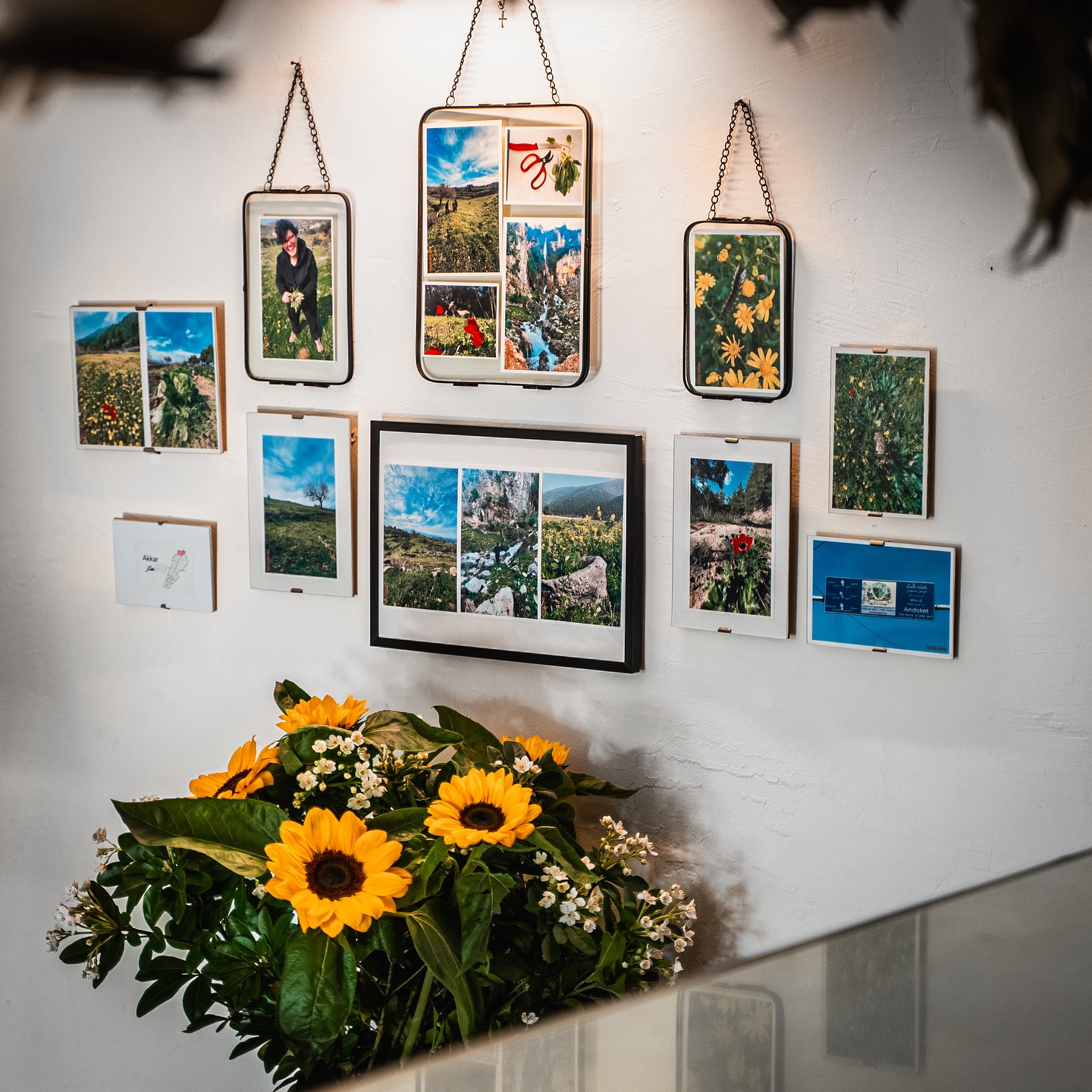 Photographs of Lebanon on the wall at Touta